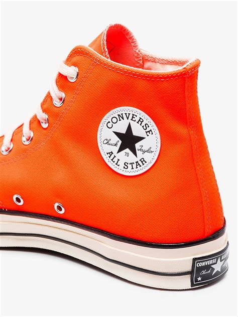 orange high top converse women.